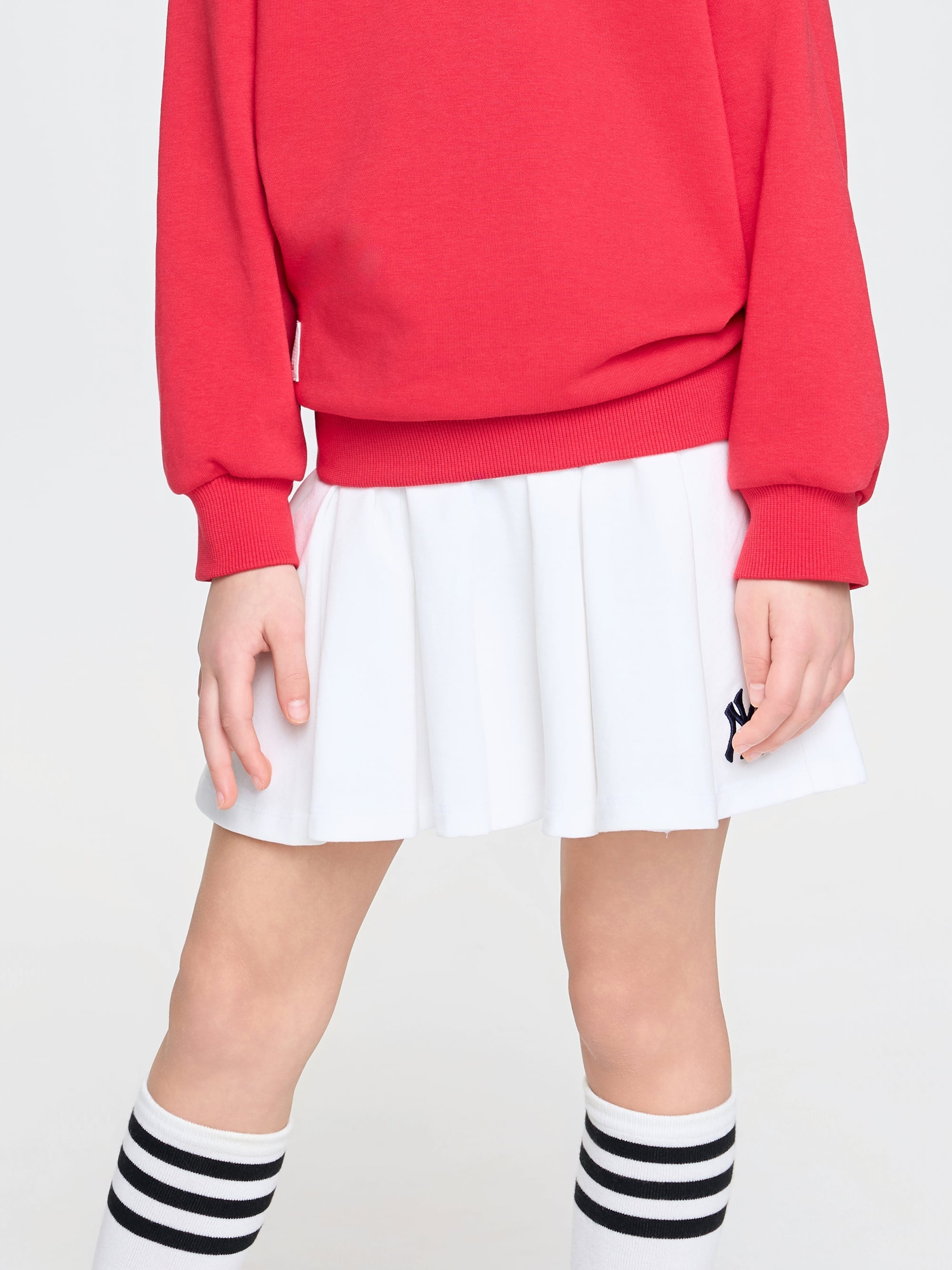 VARSITY SPORTIVE PLEATS SKIRT